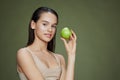 portrait woman green apple near face health close-up Lifestyle Royalty Free Stock Photo