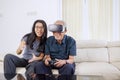 Portrait of woman guiding her dad how to play vr Royalty Free Stock Photo