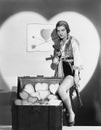 Portrait of woman with guns and trunk full of hearts