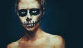 Portrait of woman with Halloween skull make up. Horror spooky skeleton visage concept Royalty Free Stock Photo