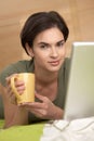 Portrait of woman having coffee in bed Royalty Free Stock Photo
