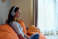 portrait of a woman headphone at home on the couch entertainment Lifestyle