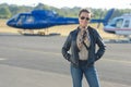 Portrait woman at helicopter landing pad