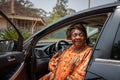 Portrait of a woman in her sixties sitting in the car. Women and transportation concept Royalty Free Stock Photo