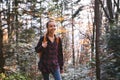 Portrait of a woman hiker walking on the trail in the woods. Royalty Free Stock Photo