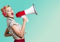 Portrait of woman holding megaphone, dressed in Royalty Free Stock Photo