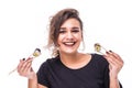 Portrait of a woman holding sushi rolla in both hands on white background Royalty Free Stock Photo