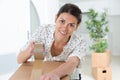 portrait woman at home sealing box for dispatch Royalty Free Stock Photo