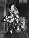 Portrait of woman with huge bouquet