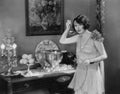 Portrait of woman with ladle and punch bowl Royalty Free Stock Photo