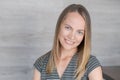 Portrait woman laughing against white brick background. Successful middle aged Royalty Free Stock Photo