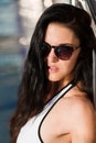 Portrait of a woman leaning on the metal fence of a pool Royalty Free Stock Photo