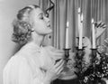 Portrait of woman lighting candles Royalty Free Stock Photo