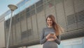 Portrait woman looking at smartphone while running outdoor. Close-up Of A Young Beautiful Sports Fitness Girl Holding A Royalty Free Stock Photo