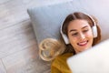 Woman lying on the floor and listening to music Royalty Free Stock Photo