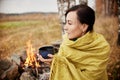 Portrait of a woman with a mug of hot tea in his hands autumn in Royalty Free Stock Photo