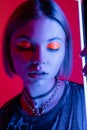 portrait of woman with neon makeup