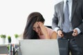 Woman office worker closing face feeling ashamed because of her boss harassment