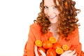 Portrait of a woman with oranges on white