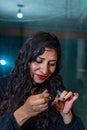 Portrait of woman painting her nails Royalty Free Stock Photo