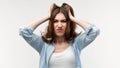 Portrait of woman in panic shouting and grabbing her head in fear or frustration. Stress and mental health Royalty Free Stock Photo