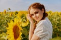 portrait of woman with pigtails in nature field in sunflower posing Royalty Free Stock Photo