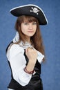 Portrait of woman pirate on blue background