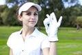 Portrait of a woman playing golf Royalty Free Stock Photo