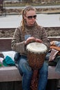 Portrait of woman plays the djembe drum in Volgograd