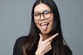 Pointing woman business glasses portrait cute fashion beautiful asian student smile background finger studio Royalty Free Stock Photo