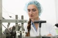 Portrait of woman quality inspector during work in cosmetics factory