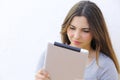 Portrait of a woman reading a tablet ebook