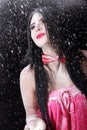 Portrait of a woman in a red bow-tie covered by white powder Royalty Free Stock Photo