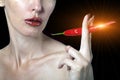 Portrait of the woman with red lips and red burning pepper Royalty Free Stock Photo