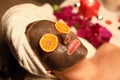 Portrait of woman with a rejuvenating face mask and orange slices on her eyes Royalty Free Stock Photo