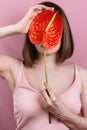 Portrait of woman`s holding red peace lilly bloom Royalty Free Stock Photo