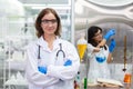Portrait woman scientist chemistry experiments in lab room. female researcher science medical standing at laboratory of hospital Royalty Free Stock Photo
