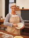 Portrait, woman and senior baking with smile in kitchen for dessert and cookies with flour for cake. Grandma, happiness Royalty Free Stock Photo
