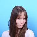 Portrait of woman with look against blue background