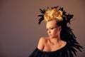 Portrait of woman shaman with raven feather in her hair Royalty Free Stock Photo