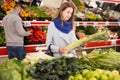 Portrait of woman shopping fresh celery in shop