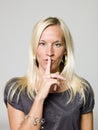 Portrait of a woman shushing Royalty Free Stock Photo