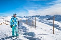 Portrait of a woman skier looking at distant slopes on the top of the snowy Pyrenees Mountains, Andorra Royalty Free Stock Photo