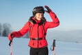 Portrait of woman-skier in red jacket