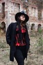 Portrait of a woman with a skull makeup dressed in corset, cardigan and a top-hat. Baron Saturday. Baron Samedi. Dia de Royalty Free Stock Photo