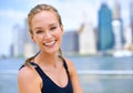 Portrait, woman and smile at river side with city view on sport clothes to jog, fitness and healthy mindset in New York Royalty Free Stock Photo