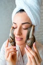 Portrait of woman with snails on her face Royalty Free Stock Photo