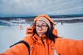 Portrait of woman on a snow-covered ski slope Royalty Free Stock Photo