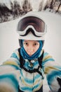 Portrait of woman on a snow-covered ski slope Royalty Free Stock Photo