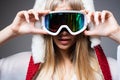 Portrait of woman snowboarder or skier in snow goggles. Girl in ski goggles. Royalty Free Stock Photo